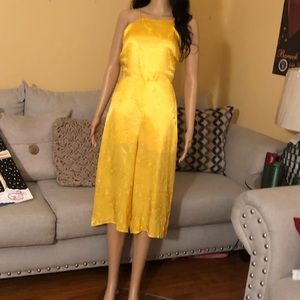 Yellow strappy knee-length romper